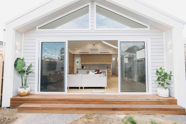 white theme house with a glass door